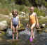 river_girls-990630.jpg (25626 bytes) Wading in the river on vacation.